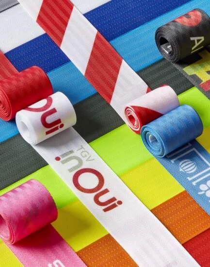 Rolls of sublimated belts in many colours